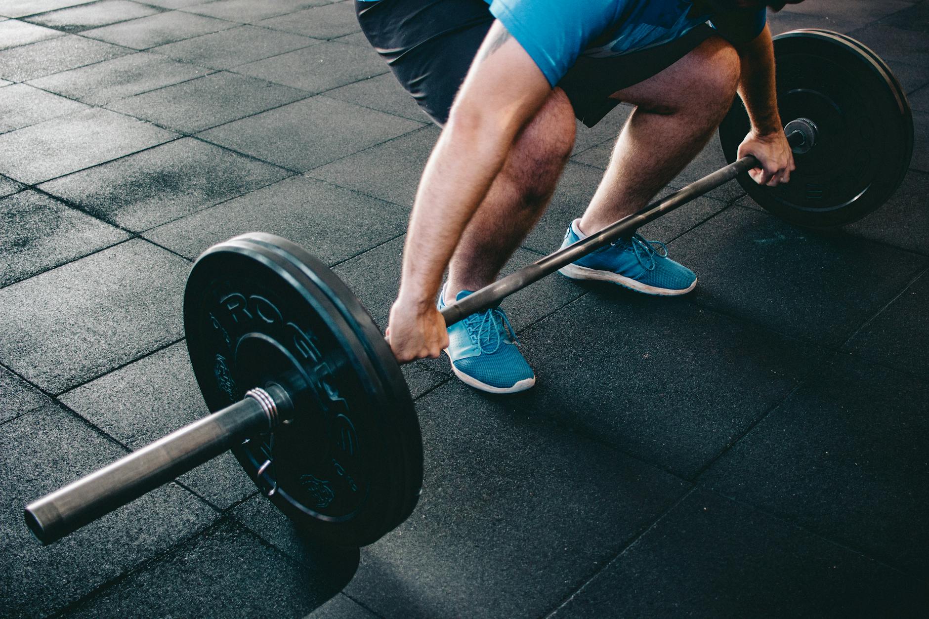 man holding barbell